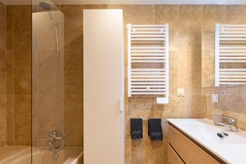 a bathroom with a sink and a shower at Large Apartment Marbella del Mar in Marbella
