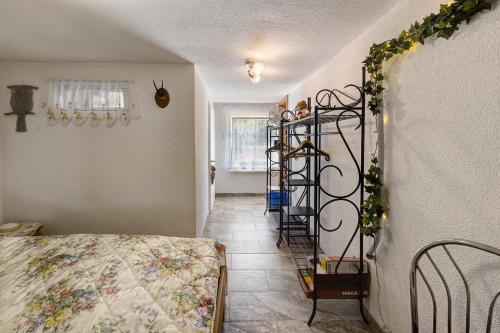 a room with a bed and a spiral staircase at Ferienwohnung im Burgenland in Freyburg
