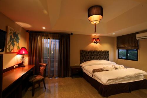 Ένα ή περισσότερα κρεβάτια σε δωμάτιο στο At Home At Chiang Mai