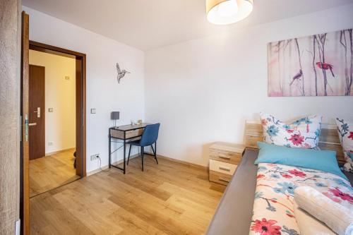 a bedroom with a bed and a desk at Erkheim in Erkheim