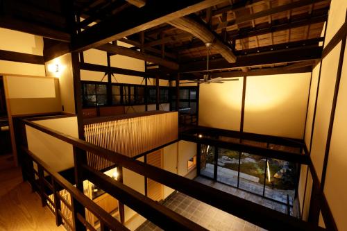 an overhead view of a room with a fish pond at Tawara-an in Kyoto
