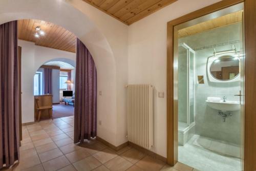 a bathroom with a shower and a sink at Sabina Dolomites Santner in Alpe di Siusi