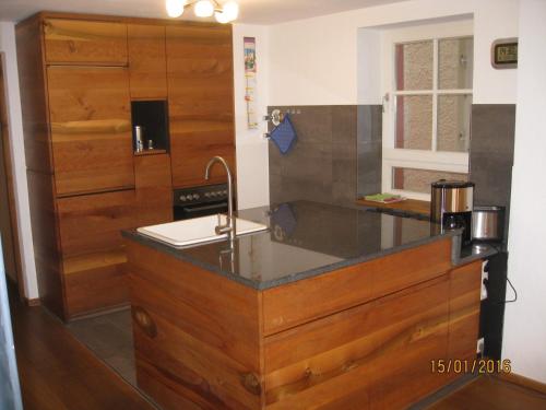 a kitchen with a sink and a counter top at Damkröger 2 Inselwohnung - Seeblick in Lindau