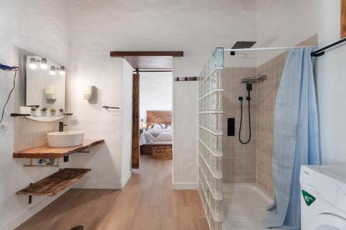 a bathroom with a shower and a sink and a toilet at El Rincón de Yeico in Isora