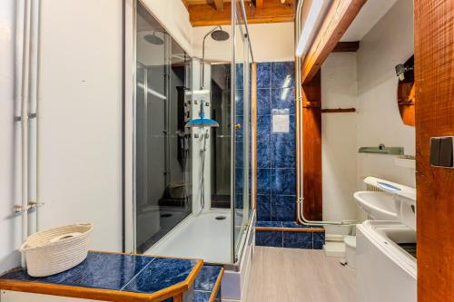 a bathroom with a shower and a sink at Loft familial Arcachon in Arcachon
