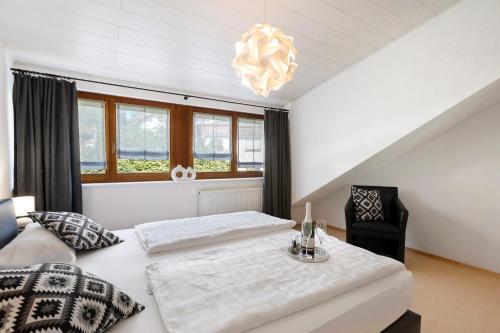 a bedroom with two beds and a table and a chair at Rinderle in Stockach
