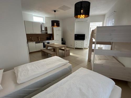 a living room with two beds and a kitchen at Dreams Unterkunft in Koetz 