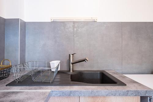 a kitchen sink with a faucet on top of it at Pré-vernay 7pers in Saint-Jean-dʼArves