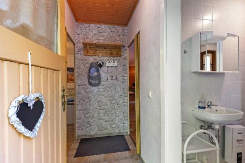 a bathroom with a stone shower and a sink at Ferienbungalow 1 in Boitzenburg in Boitzenburg