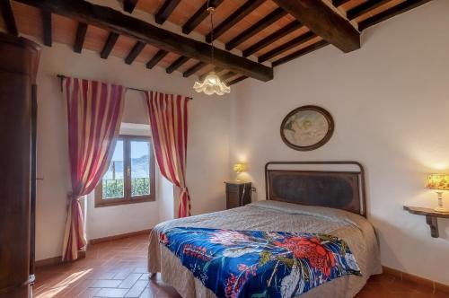 a bedroom with a bed and a window at Universal Harmony - Poiana in Dicomano
