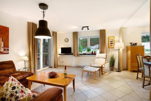 a living room with a couch and a table at Ferienwohnung Rotdorn in Schmallenberg