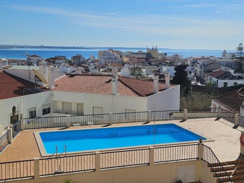 a swimming pool on the roof of a house at Your Secret in Lagos in Lagos