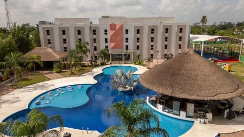 an aerial view of a resort with a large swimming pool at Hotel Royal Garden Tuxpan in Cobos