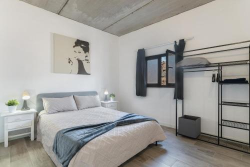 a bedroom with a bed and two night stands at Casa Jonas in Tías