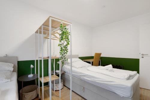 a bedroom with a bunk bed with a green wall at Business Apartment in Oberkochen in Oberkochen