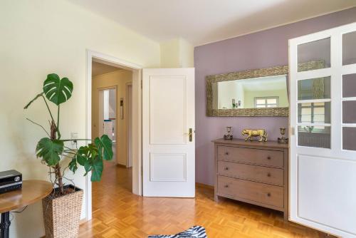 a room with a dresser and a mirror at Ferienwohnung Saline in Bad Wildbad