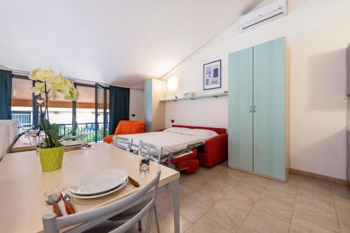 a hospital room with a bed and a table with a tablektop at Cozy studio Le Vele Garda Lake in Toscolano Maderno