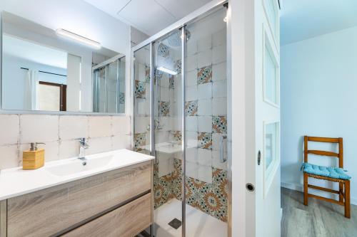 a bathroom with a sink and a shower at Albercutx Pollentia 3 in Pollença