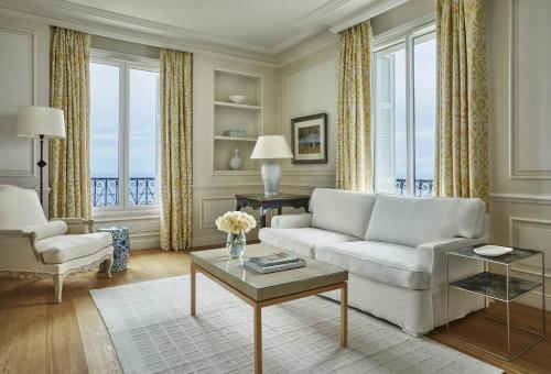 a living room filled with furniture and a window at Grand-Hôtel du Cap-Ferrat, A Four Seasons Hotel in Saint-Jean-Cap-Ferrat