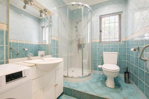 a bathroom with a toilet and a sink and a shower at Maison avec Piscine in Tourrettes