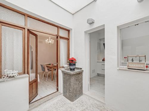 a kitchen and dining room with a table and a window at Casa Convent in Alcudia