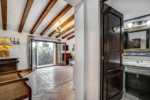 a bathroom with a sink and a mirror at Finca Can Moleta in Cala Mendia