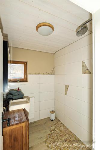 a bathroom with a sink and a toilet in it at Ferienwohnung Bienennest in Mittenwald