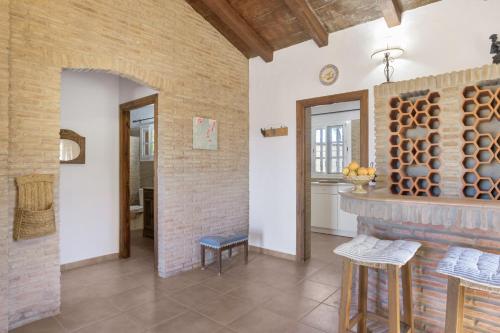a living room with a brick wall at Casa Altamar in Barbate