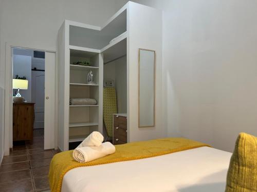 a bedroom with a bed with towels on it at Casa Eusebia in Arona
