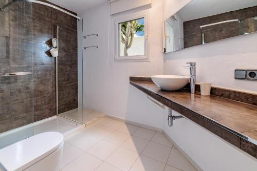 a bathroom with a sink and a shower at Casa Arola in Sant Josep de sa Talaia