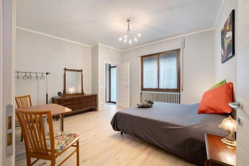 a bedroom with a bed and a table and a desk at Ragamà Massino Visconti in Massino Visconti