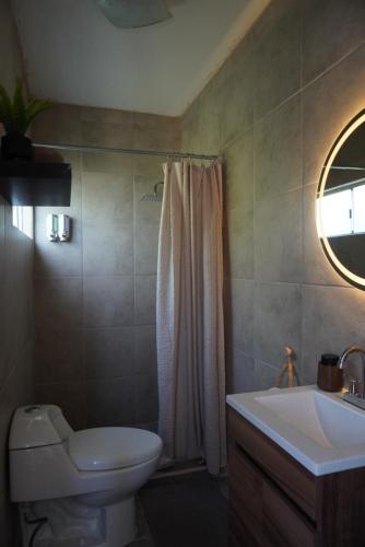 a bathroom with a toilet and a sink at Departamento zona central in La Paz