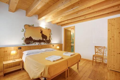 a bedroom with a bed in a room at Agriturismo Soleil Levant Torgnon in Torgnon