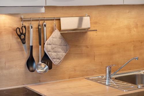 a kitchen counter with a sink and utensils at Wanderlust in Todtnau