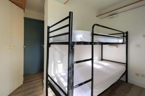 เตียงในห้องที่ Appartement Daniel