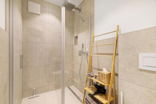 a shower with a glass door in a bathroom at Bodensee Apartment Lindau in Lindau