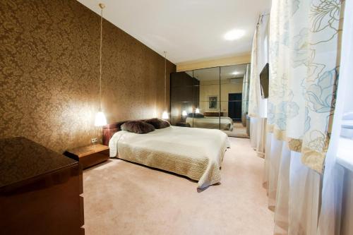 
Кровать или кровати в номере hth24 apartments on Italiyanskaya 14
