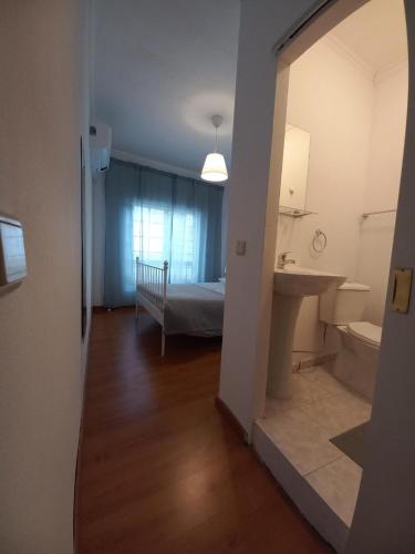 a room with a bedroom and a sink and a bed at D'ouro Relax - Douro Vinhateiro in Sanfins do Douro