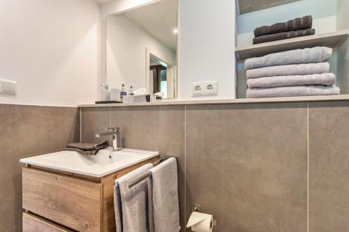 a bathroom with a sink and a mirror at Feichten Glück 16 in Siegsdorf