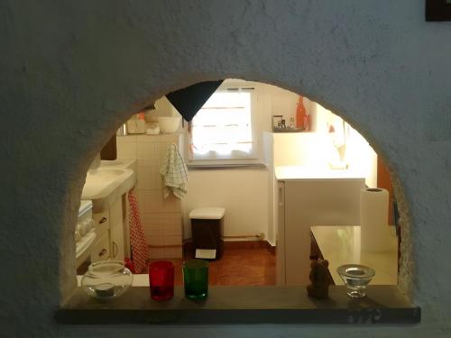 a view of a kitchen with a counter and a window at Altrove - a due passi da Chiavari in Ne