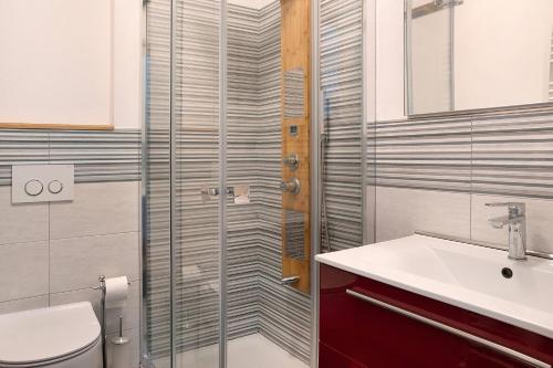 a bathroom with a toilet and a sink at Alta Valle Maira C in Acceglio