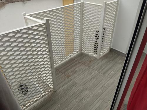 an empty room with a white metal stair railing at Alojamiento Patricia in Igualeja