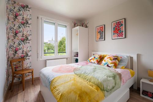 a small bedroom with a bed and a window at Gîte De L'enclume in Sévignac