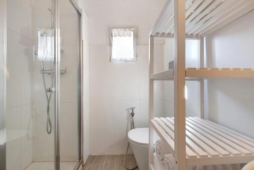 a bathroom with a bunk bed and a toilet at Villa Carla in Salò