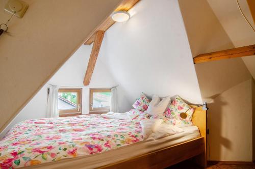 a bedroom with a bed in a attic at Das blaue Haus in Pfullendorf