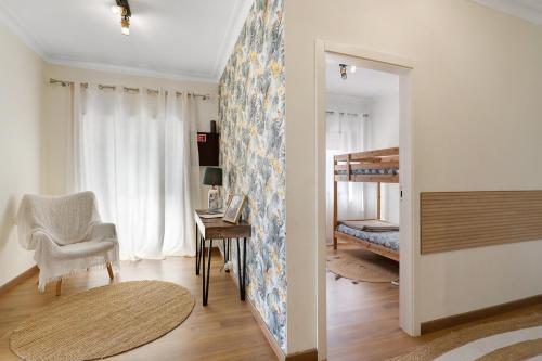 a room with a bedroom with a bunk bed at Vitóriahouse - Your Little Corner in Vila Nova de Gaia