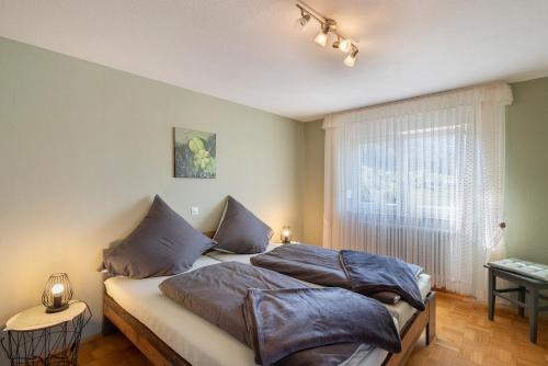 a bedroom with two beds and a window at Ferienwohnung Gabriele in Lauf