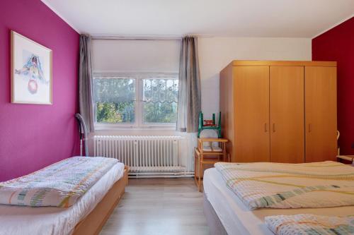 a bedroom with two beds and a window at Ferienwohnung Manuela in Sankt Englmar