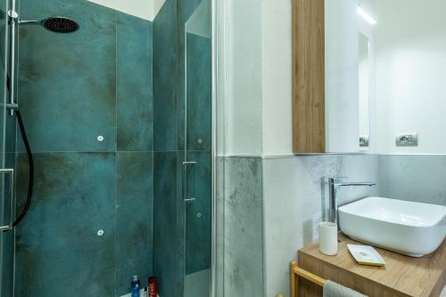 a bathroom with a shower and a sink at Il Teatro in San Gimignano