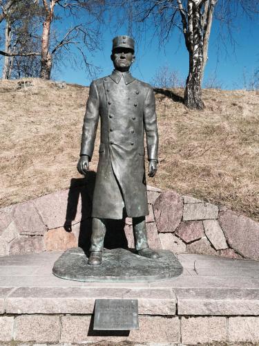 a statue of a man in a suit and hat at Oscarsborg Castle Hotel & Resort in Drøbak